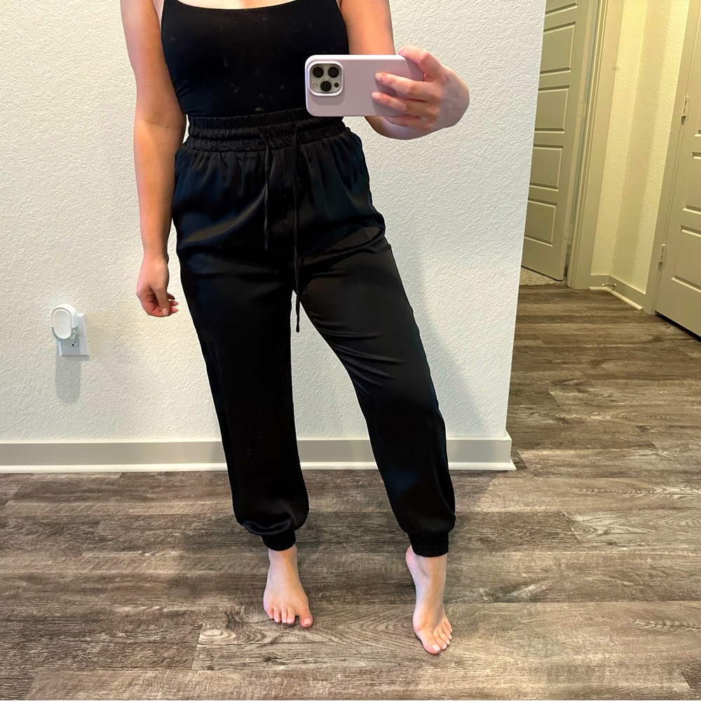 Feels and looks like satin, black joggers